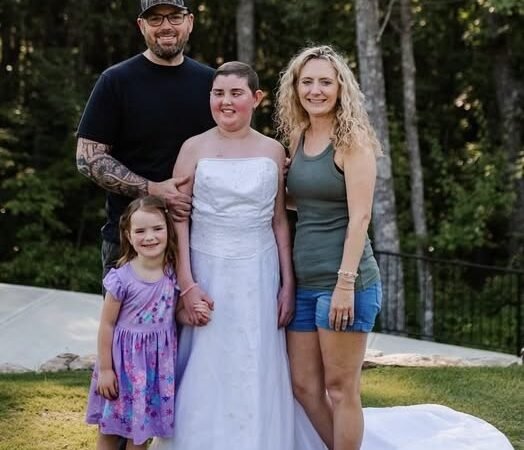 The pretty dress. The big smiles. A family holding on to each other… and to hope